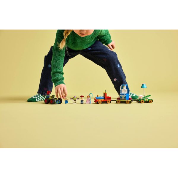 U1058151_9main Конструктор LEGO Disney та Pixar Святкування з Історії іграшок: поїзд та авто для гонок (43264)